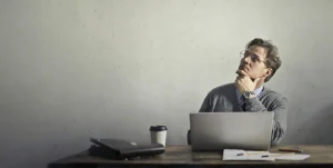 Small business owner thinking about hiring a website developer instead of using a DIY website builder.